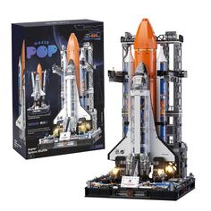 a lego space shuttle is shown in front of a box