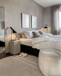 a bedroom with a large bed and mirror