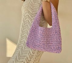 Crochet lilac small shoulder bag Trending now crochet bag a piece that will accompany you from special occasions to your daily life. The cute lilac bag provides both a youthful and dynamic look. Always carry the energy of spring and summer with you! The crochet tote bag has enough space for your daily items such as phone, headphones, wallet and makeup. It will always make a difference with its elegance and originality while accompanying you in your daily use or as a weekend bag. If you are looki Everyday Pink Knitted Shoulder Bag, Trendy Rectangular Crochet Bag, Trendy Crochet Shoulder Bag For Spring, Trendy Knitted Tote Shoulder Bag, Trendy Knitted Shoulder Bag, Cute Rectangular Crochet Travel Bag, Trendy Crochet Bag For Daily Use, Knitted Shoulder Bag For Spring, Trendy Rectangular Crochet Bag As Gift