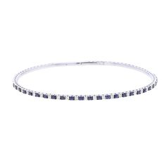 Add sparkle to your look with our Something Blue Diamond and Sapphire Bangle Bracelet. With 1 1/12 carats total weight alternating blue sapphires and round brilliant diamonds adorn a flexible bangle bracelet, crafted from 14 karat gold and titanium. Perfect for everyday wear or special occasions. Blue Diamond Bangle Fine Jewelry Bracelet, Blue Diamond Bangle Bracelet Fine Jewelry, Blue Diamond Bangle Bracelet In Fine Jewelry Style, Sapphire Jubilee Bracelet Bangle, Blue Fine Jewelry Bracelet With Single Cut Diamonds, Elegant Blue Diamond Bangle, Fine Jewelry Blue Round Bangle, Blue Diamond Bangle Bracelet With Accents, Sapphire Bangle