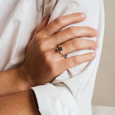 a close up of a person wearing a ring