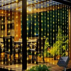 an outdoor patio with string lights on it