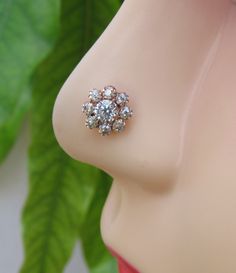 a close up view of a fake breast with an earring on it's side