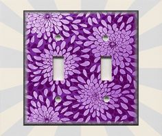 two light switch plates with purple flowers on them