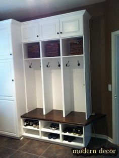 a room with some white cabinets and shoes