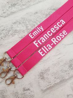 One personalised lanyard with trigger clip. Add required text in the personalisation box.  A clear plastic landscape card holder is optional- if required please select from the drop down box. The card holder is rigid and fits normal size credit cards. 2cm in width and measures approximately 45cm drop from the back of the neck (total length 90cm). Features a black breakaway neck clip at the top.  The breakaway clip is designed as a safety future and emergency use only - not for regular use. Lanyard Pink, Pink Lanyard, Personalized Lanyards, Lanyard Teacher, Custom Lanyards, Handmade Hair Bows, Name Badges, Id Holder, Badge Holders Lanyard