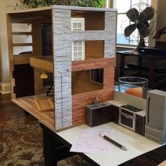 a doll house is sitting on a table