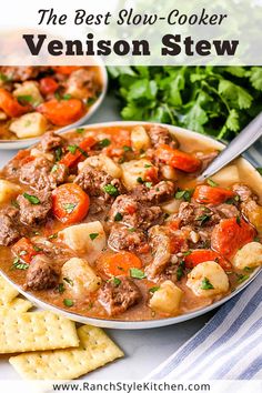 two bowls filled with stew next to crackers and parsley