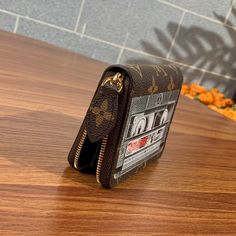 a wallet sitting on top of a wooden table