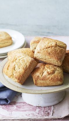 a white plate topped with muffins on top of a table