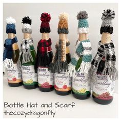 several bottles of wine are lined up in the shape of people with hats and scarves