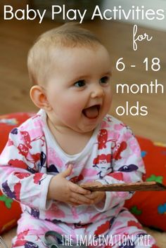 a baby is sitting on the floor with her mouth open and holding a wooden spoon