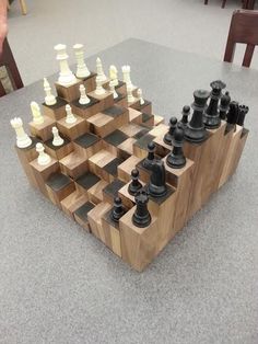 a wooden chess board sitting on top of a table