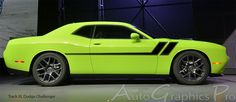 a bright green car is on display at an auto show