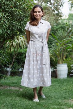 Maria fuses the old-world charm of authentic cotton flex with the modern silhouette of a Mid length dress. The light cotton with polka dot print is adorned with side belt and mega sleeves. The dress comes with two side pockets for perfect look. Mega Sleeves, Kurti Casual, Angrakha Dress, Side Belt, Cotton Frocks, Mid Length Dress, Frill Dress