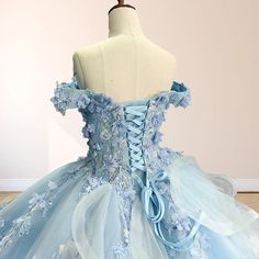 Step into a fairy tale with the Sky Blue Lace Princess Quinceanera Dress Ball Gown. This enchanting gown features a voluminous ball gown silhouette and is crafted from soft tulle for a light, ethereal feel. The stunning sky blue color adds a sense of serenity and elegance. The off-the-shoulder neckline and sleeveless design offer a flattering yet romantic touch, drawing attention to your shoulders and neckline. The corset back ensures a perfect, tailored fit, allowing you to feel both comfortabl Cinderella Sweet 16 Dresses, Baby Blue Quinceanera Dresses, Baby Blue Quinceanera, Touch Drawing, Cinderella Sweet 16, Gown Silhouette, Quinceanera Dresses Blue, Dress Ball Gown, White Homecoming Dresses