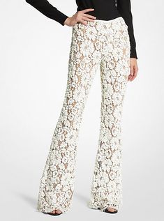 Intricately tailored in floral lace with nude silk lining, these trousers are an ultra-romantic upgrade to basic flares. Featuring elaborate paillette hand-embroidery, they’re designed with a concealed side-zip fastening and scalloped hem. Wear yours with a coordinating tunic or a shoulder-baring blouse.