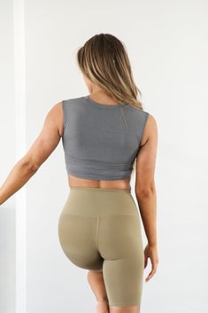 Embrace the sweat in this supportive Eva Essential Cropped Top. Sleek, soft and comfortable meets function in this workout top. Be confident during your next sweat sesh knowing you're covered. This sleeveless top has a cropped hem and high neck. Model is 5’5” wearing a size small Total Length of a small is 13.5" 72% Nylon, 28% Lycra Versatile Compressive Crop Top For Workout, Comfortable Yoga Crop Top, Functional Crop Top For Yoga, Functional Yoga Crop Top, Supportive Compressive Tops For Pilates, Functional Compression Crop Top For Pilates, Athleisure Medium Support Crop Top, Supportive Sleeveless Activewear For Pilates, Yoga Activewear Crop Top With Light Support