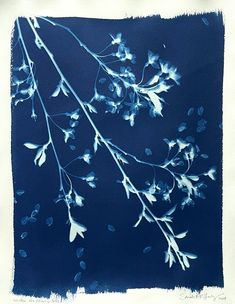 a blue and white painting of leaves on a branch