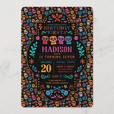 an image of a birthday party card with skulls and flowers on the front, in bright colors