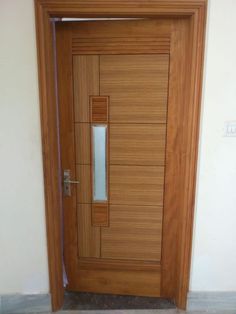 the door is made of wood and has a glass paneled design on it's side