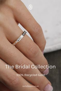 a woman's hand holding a wedding ring with the words the bridal collection on it