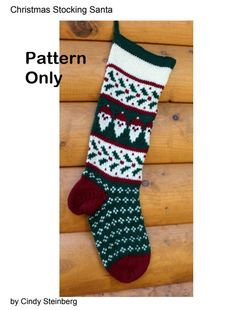 a knitted christmas stocking with reindeers and snowflakes on the bottom