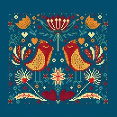 two birds on a blue background with flowers and leaves in the center, cross stitch pattern