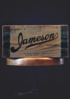 a wooden sign with the name jamesonn on it