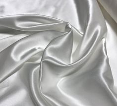 the white fabric is very soft and shiny