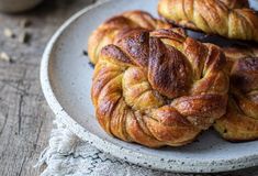 some croissants are on a white plate