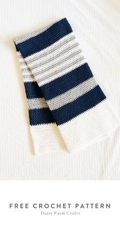 a blue and white striped knitted tie laying on top of a white shirt with the text free crochet pattern