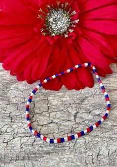 Very pretty tila bracelet in Patriotic Red White Blue. The tila beads are by Miyuki  and are glass. The tila beads are 5mm wide and 5mm long, small tile beads.  Stretch bracelet easy on easy off. The Tilas lay flat on your wrist and the bracelet is very lightweight.  It's a great bracelet by itself or stacked with others. Bracelet for 4th of July Memorial Day etc.  These beautiful, stretchy bracelets/anklet made from Japanese Miyuki Tila Beads. Tila beads are flat square beads that lay flat on your wrist without being bulking. They are lovely with just one bracelet or gorgeous stacked with other beaded bracelets. Wear one or several to change up your look.   UniquelybyRuth pays for your first class shipping when your order is $35 or more, so take a look around the shop and see if anything Multicolor Round Beads Bracelet For 4th Of July, Patriotic Colorful Beads Bracelet For Gift, Red Round Beads Bracelets For 4th Of July, Multicolor Beaded Bracelets For 4th Of July Gift, Multicolor Beaded Bracelets For 4th Of July, Patriotic Beaded Bracelets With Colorful Beads As Gift, Red Beaded Bracelets For 4th Of July, Patriotic Red Beaded Bracelets As Gift, Patriotic Red Beaded Bracelets