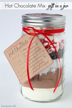 a mason jar filled with hot chocolate mix and gift in a jar for someone's birthday