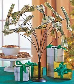 the money tree has been decorated with dollar bills and is ready to be used as a centerpiece