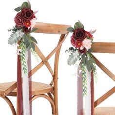 two chairs decorated with flowers and greenery on the back, one is white and the other is red