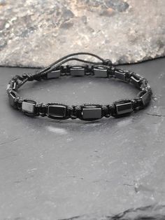 Adjustable men's bracelet with natural hematite rectangular beads and black nylon cord 1mm high quality. Hematite  have an excellent grounding and balancing energy. They are also powerful aids to stimulate the mind. They enhance memory and evoke deep thought. They also have a highly protective energy. They will assist the development of logical thought processes, and help you reach the highest capacity possible. They will heighten self confidence, will power and self-esteem. You can select the b Rectangular Black Beaded Bracelets For Gifts, Black Rectangular Beaded Bracelets For Gift, Adjustable Black Rectangular Beaded Bracelets, Black Minimalist Beaded Bracelet With Adjustable Cord, Protective Energy, Knotted Bracelet, Bracelet Macrame, Slide Lock, Hippie Bracelets