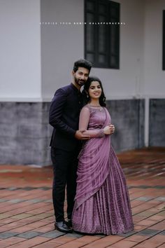 a man and woman standing next to each other