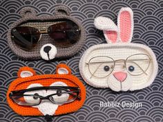 three crocheted animal purses with glasses on them, one in the shape of a fox and the other as a bear