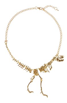 Make an impression with this shiny gold-tone T-Rex dinosaur bone statement necklace. 10" length + 2" extender Adjustable lobster clasp Metal alloy Imported Dinosaur Necklace Diy, Animal Bone Jewelry Gold, Shein Dinosaur Necklaces, Dino Earrings Gold, Dinosaur Necklaces, Dinosaur Necklace, Fossil Jewelry, Dinosaur Bones, Necklaces