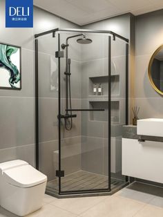 a bathroom with a toilet, sink and stand up shower in the middle of it