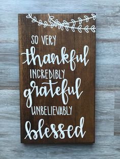 a wooden sign with the words so very thoughtful incredibly grateful unbelevably blessed