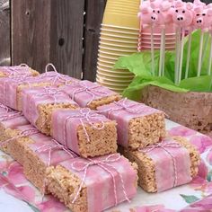 several pieces of cake sitting on top of a table