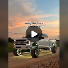 a truck driving down a dirt road with the words losing the 1 year relationship on it