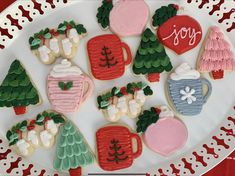 decorated cookies on a plate with christmas decorations