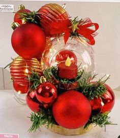 two pictures of red ornaments in a vase with greenery and lights on the side