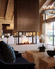 a living room filled with furniture and a fire place next to a large glass window