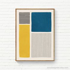 a painting hanging on the wall next to a white brick wall with blue, yellow and black stripes