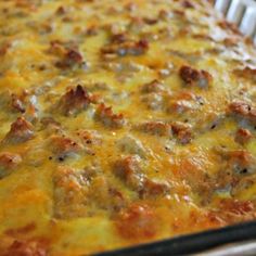 a casserole dish with meat and cheese in it