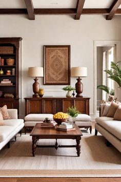 Elegant living room with white sofas, wooden coffee table, decorative fruit bowl, and large framed artwork on the wall. Federal Interior Design, Colonial Indian Interiors, British Indian Aesthetic, Colonial Interior Design Modern, Colonial Chic Interior Design, Colonial Farmhouse Interior Design, American Colonial Interior